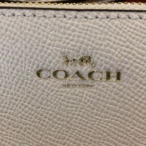 Creamy white Coach wristlet